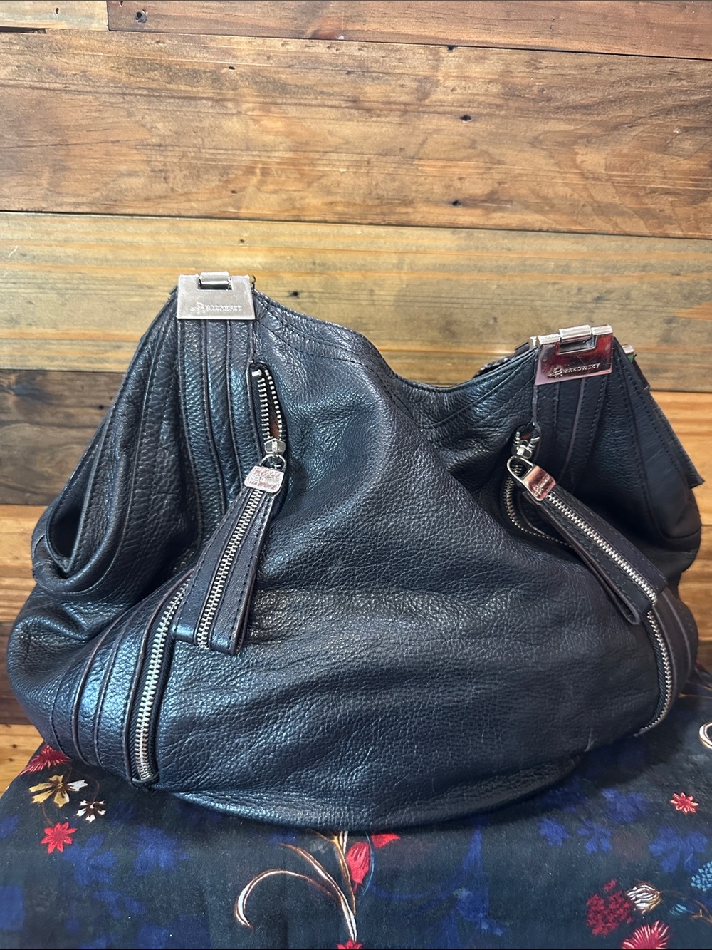 B Makowsky- large black slouchy bag. 100% leather with silver buckles.